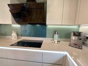 View of hob and hood in platinum kitchen